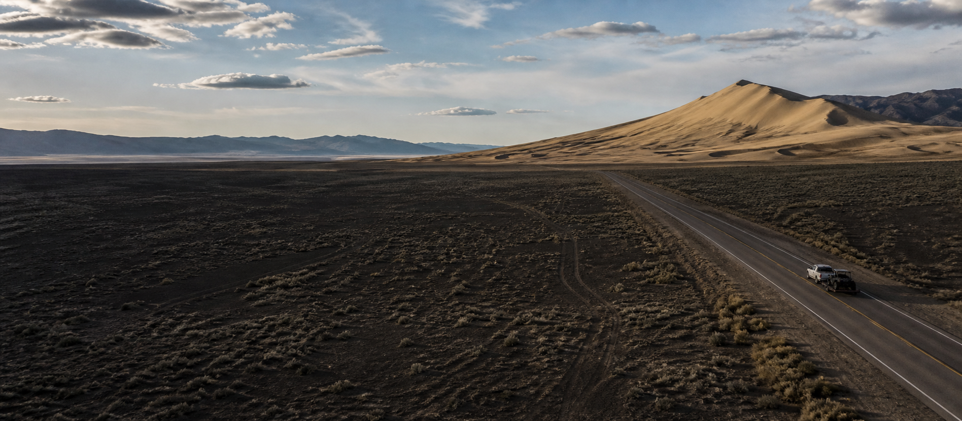 A tow rig approaching Sand Mountain across Nevada's Great Basin on U.S. Route 50